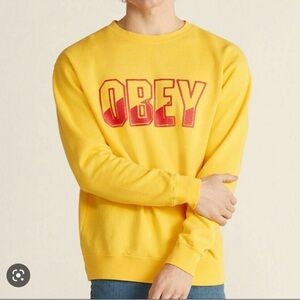 OBEY Fleece Long Sleeve Crewneck Sweatshirt in Yellow with Red Logo